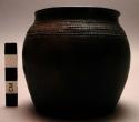 Jar, ceramic, flat base, rounded body, constricted rim, incised designs, chipped