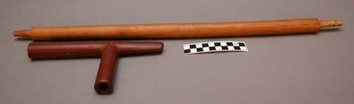 Pipe. Wood stem round in cross section, undecorated. Inverted T-shape
