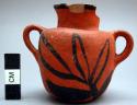 Miniature pottery vessel black on red