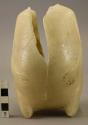 Vase, alabaster, in shape of the body of a kneeling figure