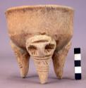 Medium sized tripod pottery bowl with tall legs