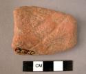 Fragment of red haematite, ground on two sides