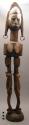 Smooth hard wood figure held up by 2 figurines, smooth even carving