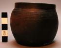 Jar, ceramic, flat base, rounded body, constricted rim, incised designs, chipped