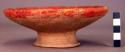 Red pottery plate, white annular base