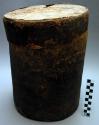 Bark pail containing paraphenalia for nge cult ceremonies