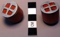 Pair of wooden ear plugs - painted red, tin attached to one end; worn +