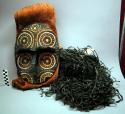 Painted pitch Jurupari mask (devil) on bark cloth hood - long black raffia tassels