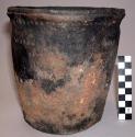 Ceramic jar, flat basket impressed base, flared & grooved rim, punctate shoulder