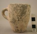 Grey pottery cup with handle