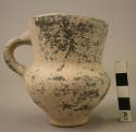 Grey pottery cup with handle