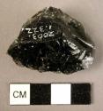 Stone, chipped edged tool, side scraper?, obsidian, black, ovate