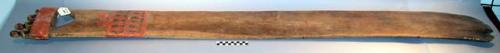 Wooden paddle or perhaps steering oar. a-morphic carving at paddle end. add. geo
