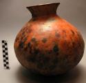 Narrow necked red jar - ornamented with impressed design