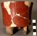 Restored red polished pottery flat- bottomed straight-sided tripod bowl
