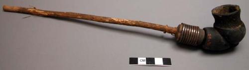 Pipe with clay bowl - iron spiral about neck, incised decoration