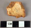 Square-ended scraper of fossil wood