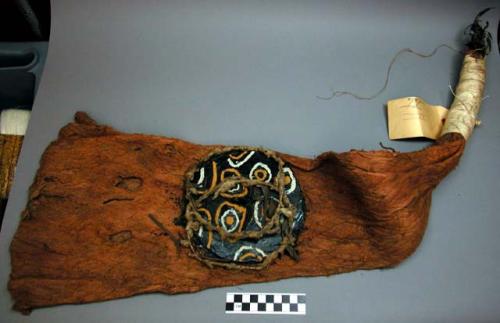 Painted pitch mask on bark cloth with long black raffia tassel (hoop ears)