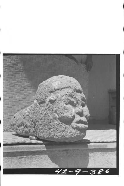 Sculpted stone head with tenon