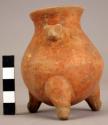 Small tripod pottery jar with constricted neck and lug in the shape of an animal