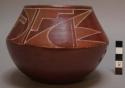 Red-on-red carinated bowl