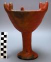 Incense burner, pottery, with three groups of three prongs on lip of cup.  Verti