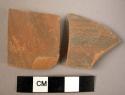 Ceramic body sherds, thin high-fired fine ware, red with black slipped exterior