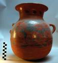 Pottery water jar, red and black