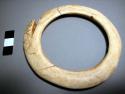 Shell ring, hung from neck