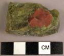 Flake of red and green stone