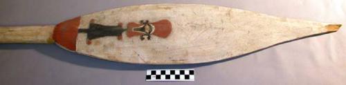 Wooden paddle - blade painted with white human-like figure on one side