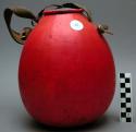 Gourd container, red, grn/pk coiled basketry lid, hide handle & hinge, lid stuck