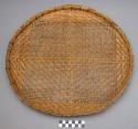Large woven bamboo tray for winnowing rice