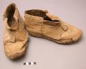 2 shoes - made of Besud rawhide; soles bob-nailed; (popusi xomi)