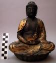 Carved wood Buddha on lotus base