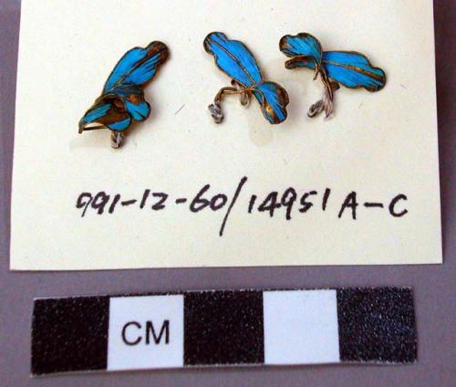 Three Ornament(s) Fragments of Gilt Metal and Feathers