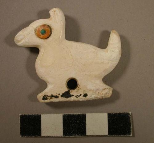Carved shell pendant - in shape of bird with inlaid eyes