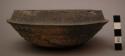 Bowl, rounded base and body, ridged, insloping rim, chipped