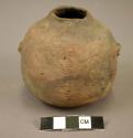 Ceramic jar, small, undecoraed grey ware, handles broken, small mouth