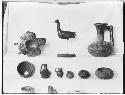 Vessels and animal figure, slate