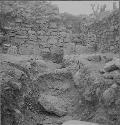 Q151 cut 4, view looking E through trench and breach in bench wall to caracol