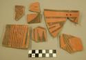 Rim and body sherds, Chaco redware, one perforated and mended