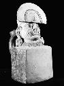 Stirrup vessel (spout missing), human head on cube with fangs