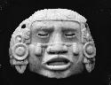 Carved jadeite human face mask of goddess Coyalxanhiu