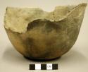 Outcurved bowl; conical, flattened base, much of rim and part of body broken off
