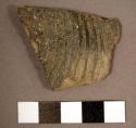 Body sherd, gray--exterior: series of parallel curved incised lines. sweet wate
