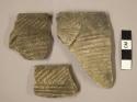 Ceramic rim sherds, incised parallel lines, one sherd mended