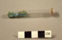 Glass tube with mineral fragment