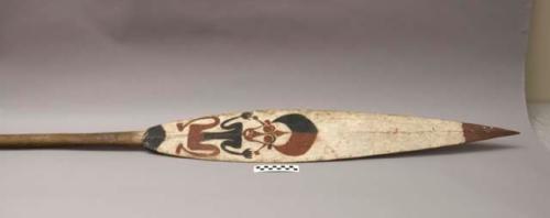 Carved and painted wooden canoe paddle