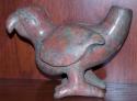 Colima parrot with a spout in its tail.  Red polished slip.  Toes on right foot
